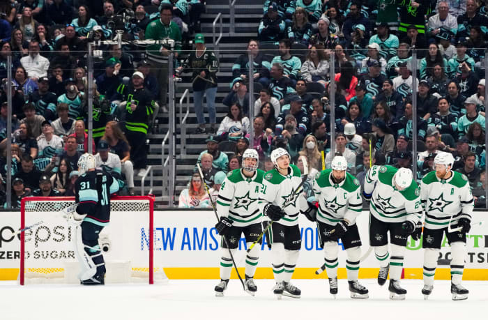 The Stars celebrate a goal by Jamie Benn against Seattle Kraken goaltender Philipp Grubauer.
